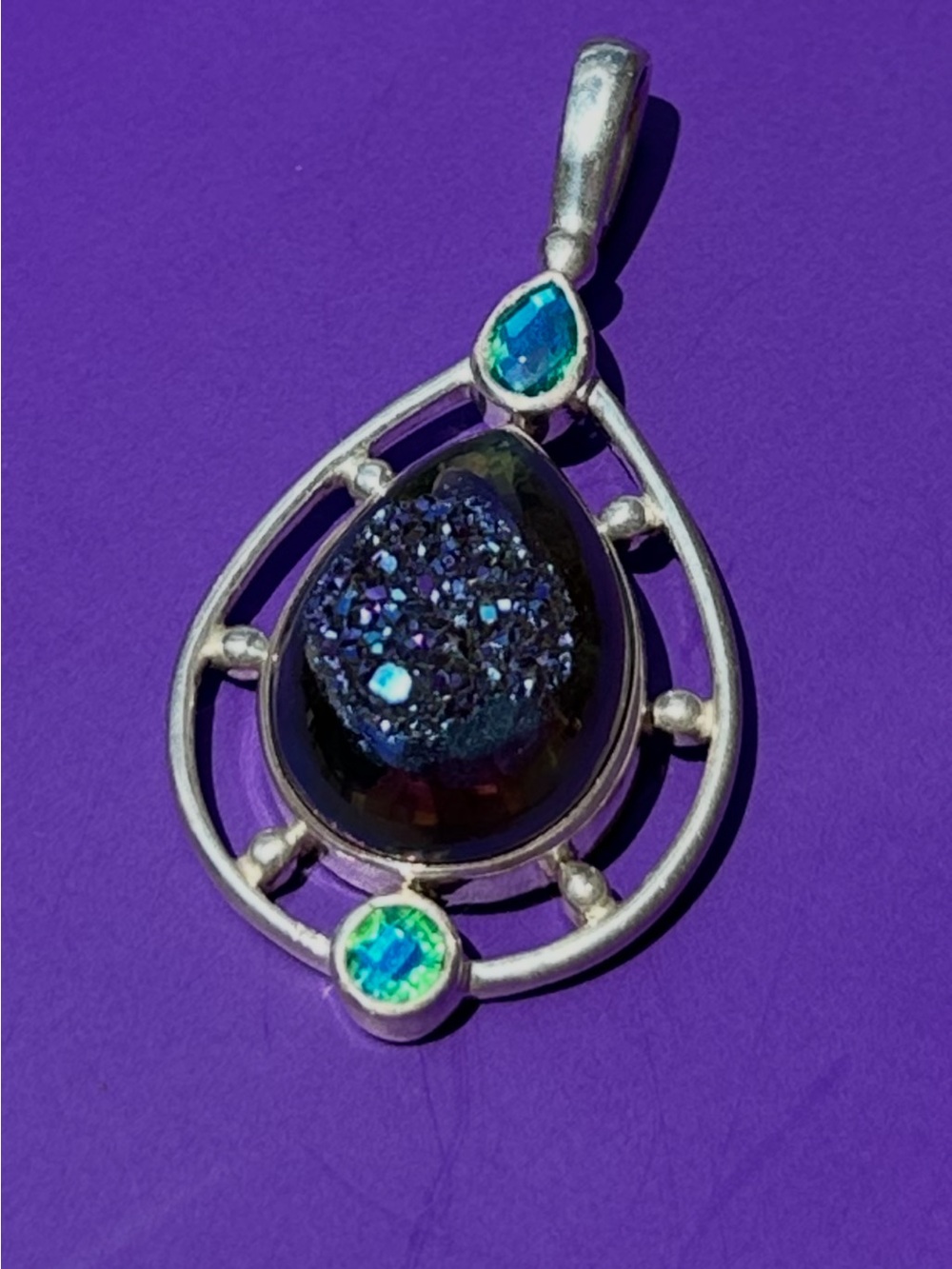 Sterling Silver Teardrop Pendant with Iridescent Amethyst& blue topaz Accents.